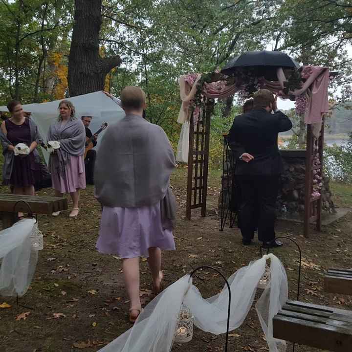 There is an umbrella on top of the arch to keep our officiant dry.