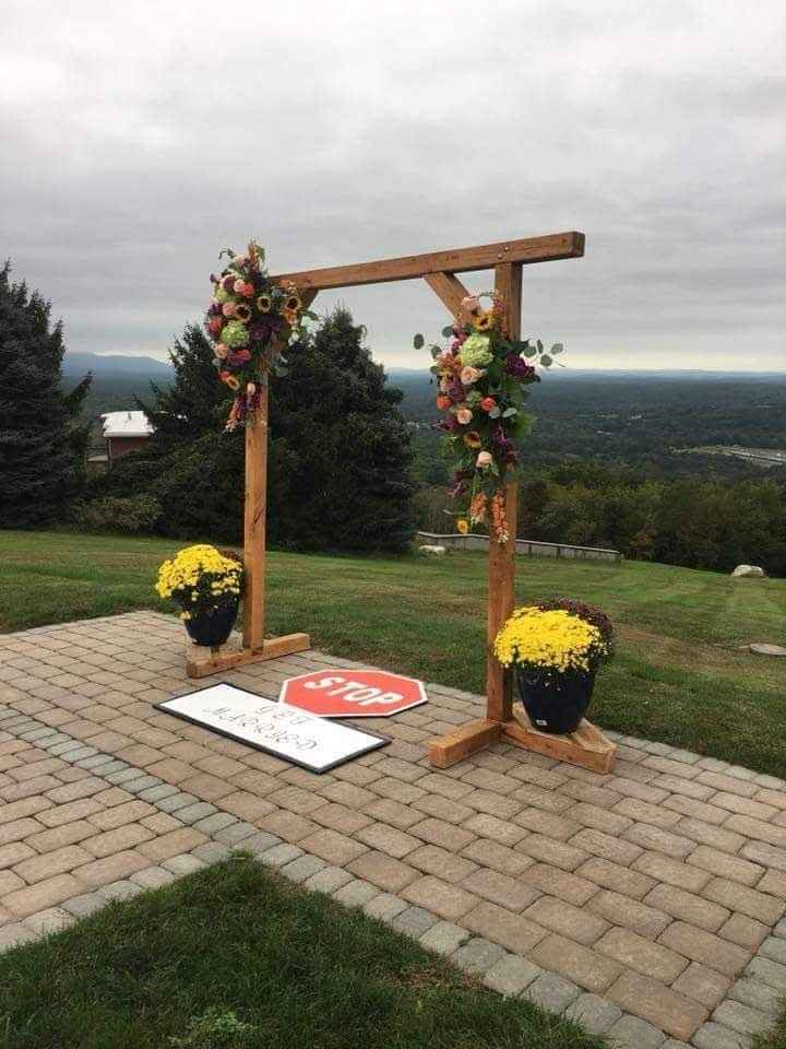 Our arch my Husband made! Along with our stop get married signed he also made!