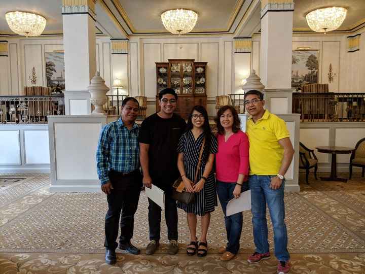 Visiting the reception venue with the parents.