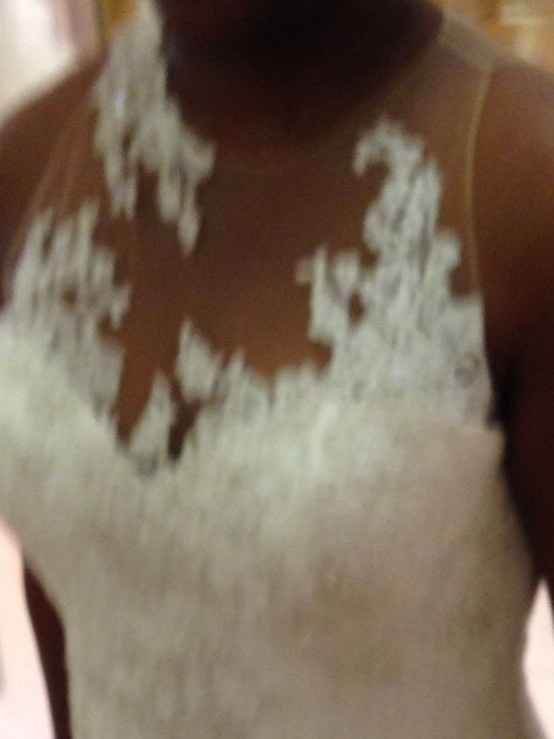 Wedding dress with a nude mesh and appliqués on top