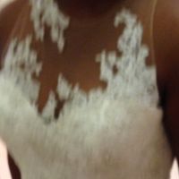 Wedding dress with a nude mesh and appliqués on top