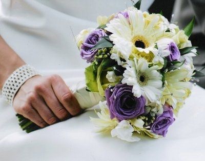 can't decide on a color theme or flowers... maybe purple, silver, and black???