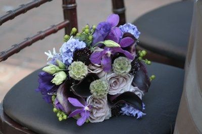 can't decide on a color theme or flowers... maybe purple, silver, and black???