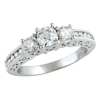 23 small diamonds, and one bigger diamond... I LOVE IT. Lets see some rings my fellow brides.