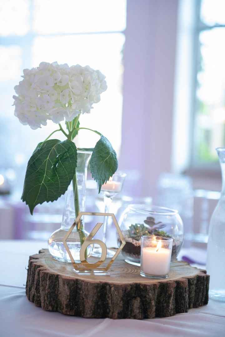 Centerpieces. Wood slabs cut from tree, vases and candles from dollar store, hydrangea from Jewel, n
