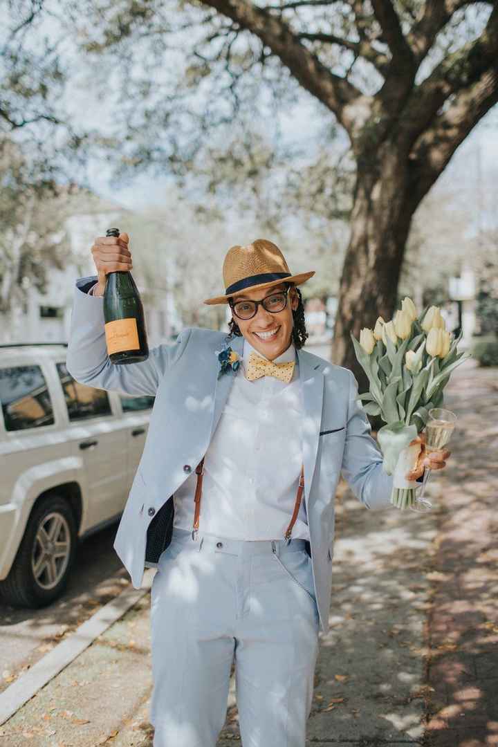 This bride pulled out all the stops with hat, bow tie, and suspenders!