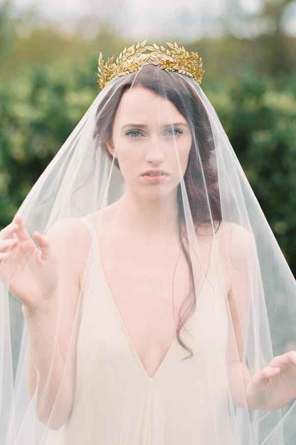 Side style, secured with tiara or crown