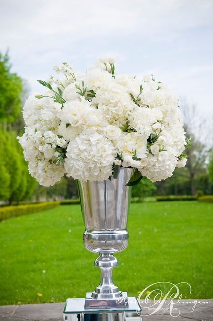 add a tall vase of flowers in front of each podium