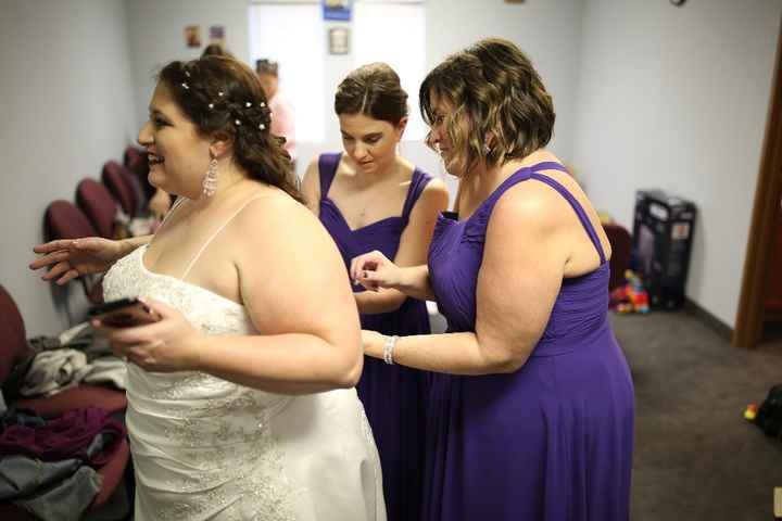 Getting laced into my dress.