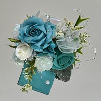 Can anyone help me? Can’t decide between these two boutonnieres - 2