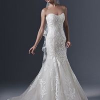 How much did you spend on your wedding dress??