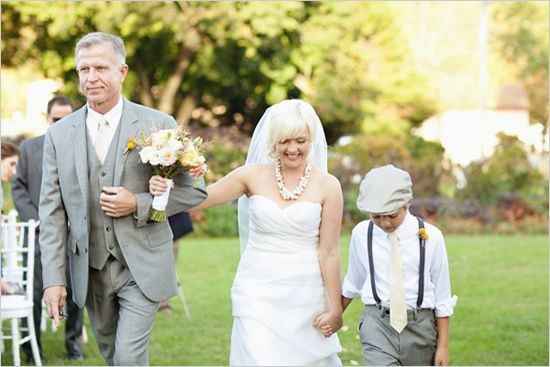 Bride walking with her father and her son