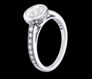 23 small diamonds, and one bigger diamond... I LOVE IT. Lets see some rings my fellow brides.