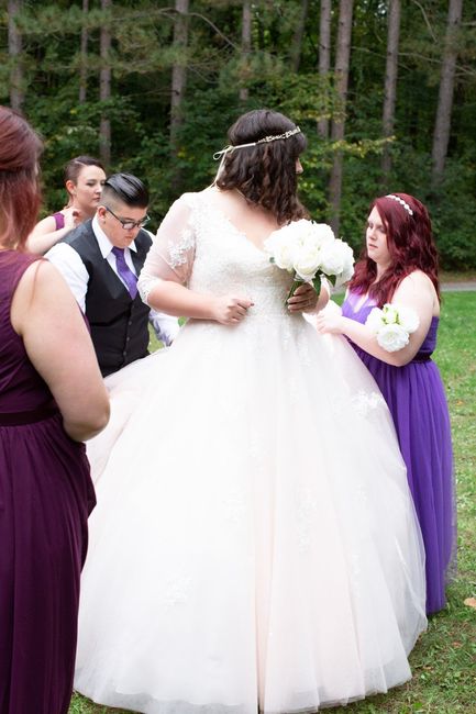 It took about 5 people to get my 3 point bustle done up...eventually the photographer had to do it b