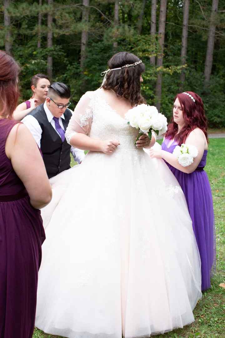 It took about 5 people to get my 3 point bustle done up...eventually the photographer had to do it b