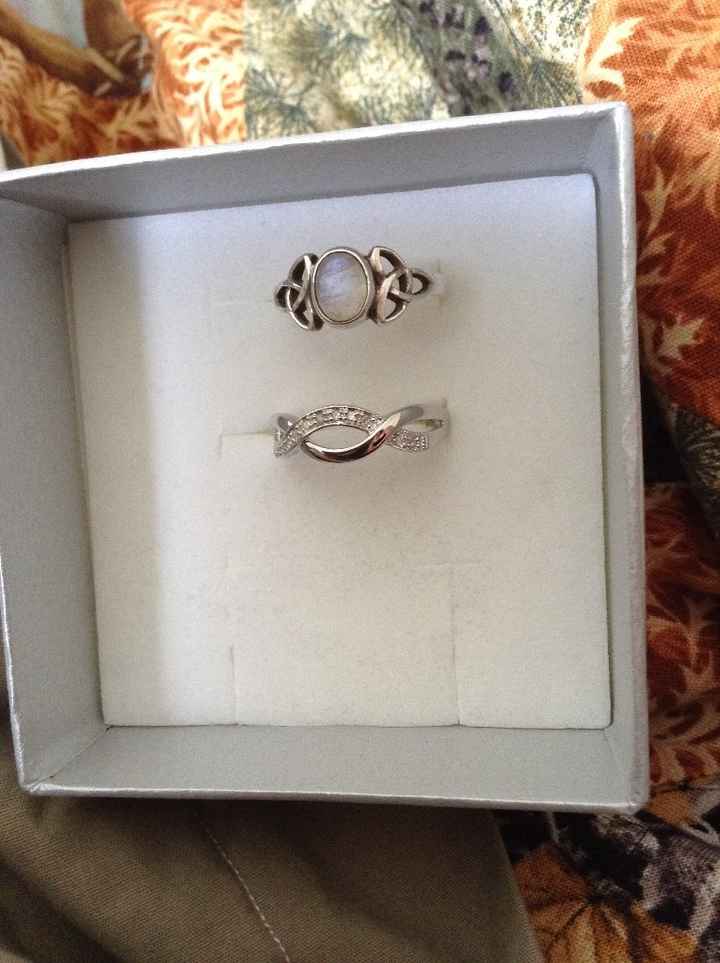 Engagement ring on top, wedding ring on bottom