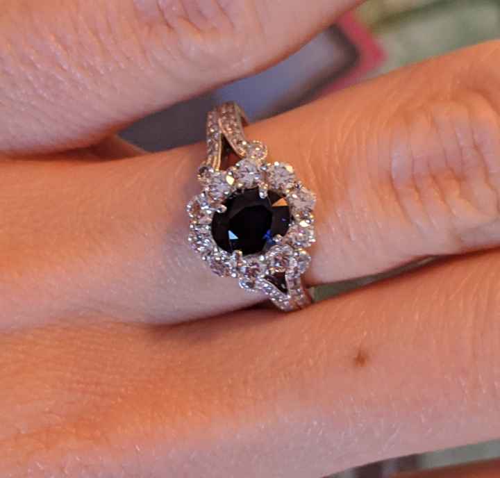 Sapphire surrounded by diamonds 