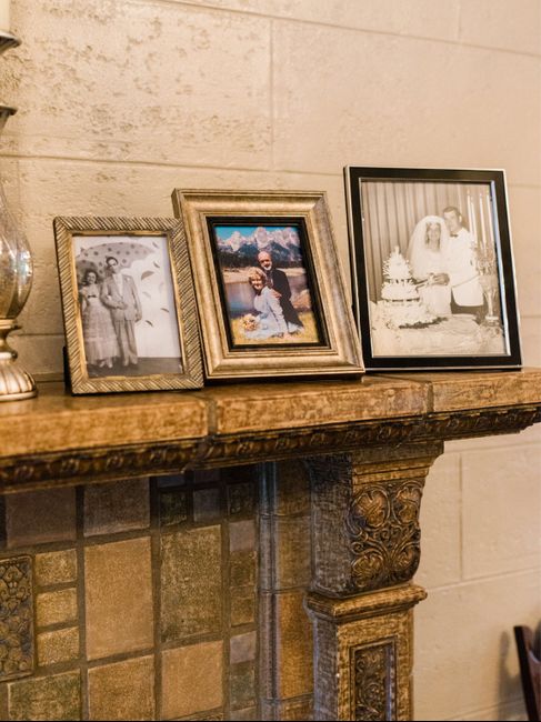 Displaying family members wedding photos at wedding - 2