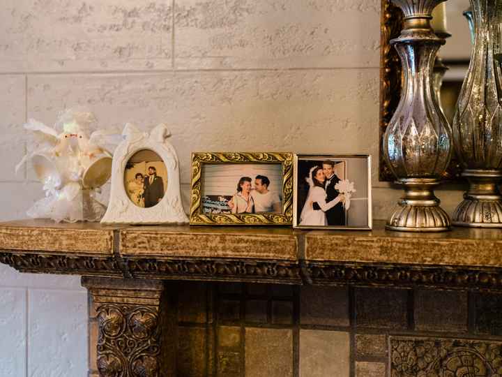 Displaying family members wedding photos at wedding - 1