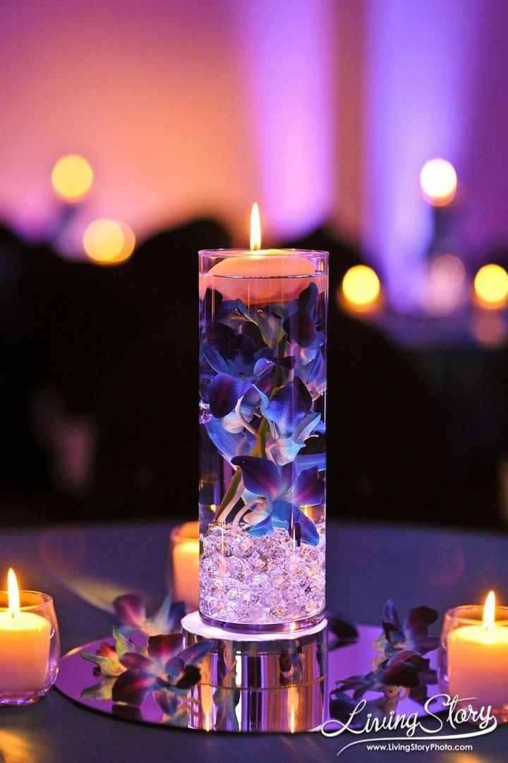 silver base, faux or real plum flower in inexpensive candle holder