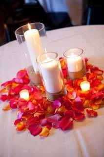 glass pillar candles with flower petals (your colors)