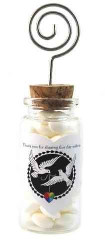 buy jars with cork top and stick a name card holder in it
