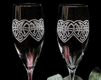 Toasting flutes, invites, cake server with Celtic symbols.