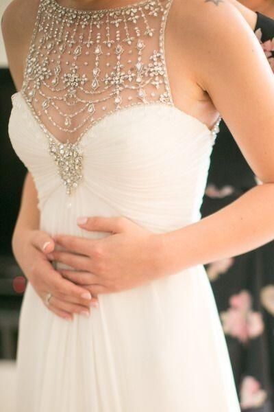 Who's NOT wearing white or ivory?