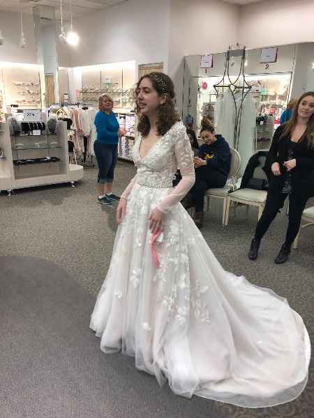 Me in the store. (Disregard the depth of the neckline in this photo. That dress was not my size.)