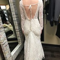 Trying on at the tailor, possibly adding cross ribbon