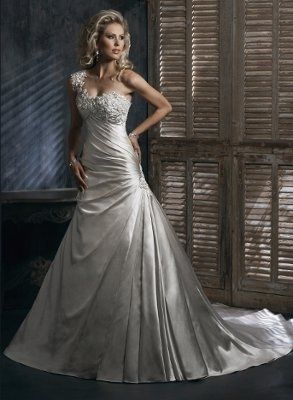 If you had an unlimited budget, What is your dream wedding dress ?