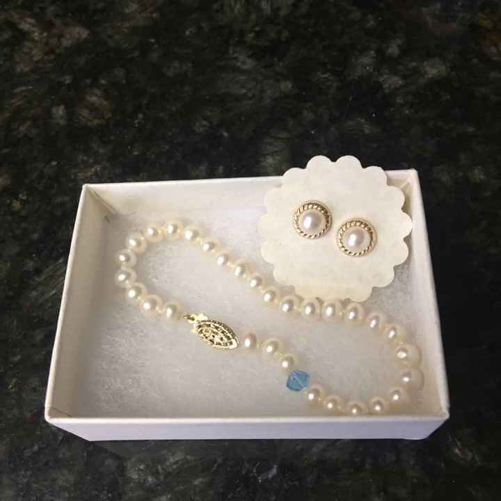 Something old, new, borrowed, blue and sixpence in her shoe