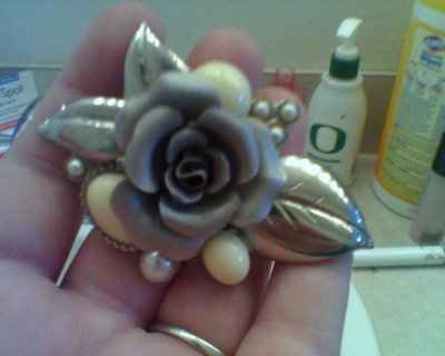 My FMIL just gave me my "something old." :) It's such a precious gift. A 1920's broach for my bouque
