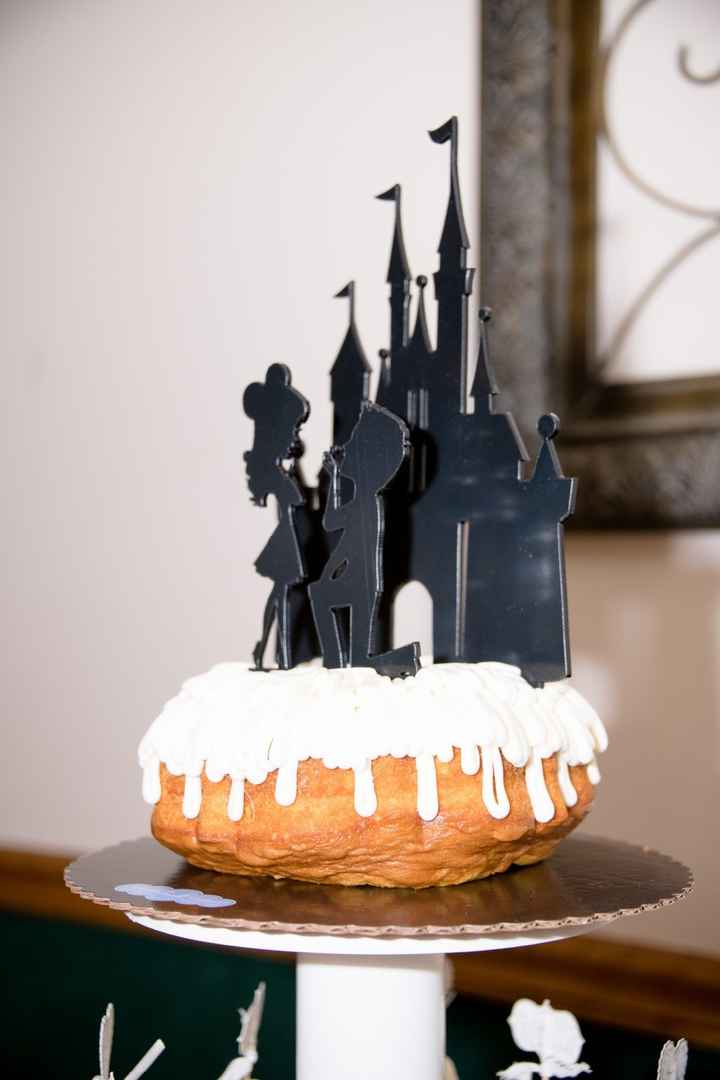 Our cutting cake and cake topper. (we got engaged at Disneyland in front of the castle)