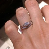 Does anyone have a twisted band diamond engagement ring? And what kind of wedding band did you get?