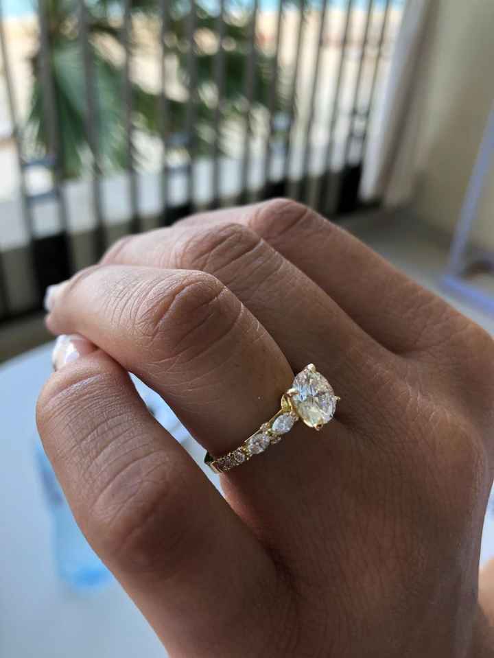 yellow gold band with marquise and round diamonds on the side