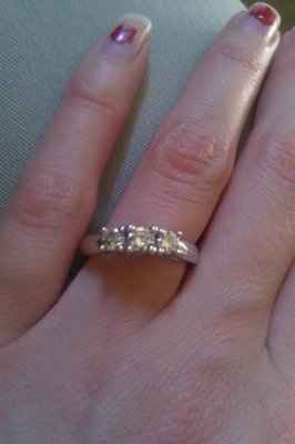 23 small diamonds, and one bigger diamond... I LOVE IT. Lets see some rings my fellow brides.