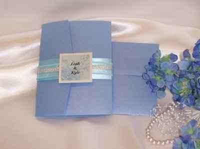 "Tropical" theme for reception... centerpeices decided, but not much more. Suggestions?