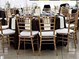 black satin table linens   gold chiavari chairs