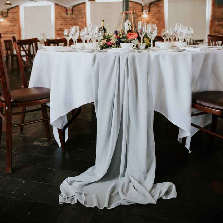White Round Tables with a Black Chiffon Runner? 1