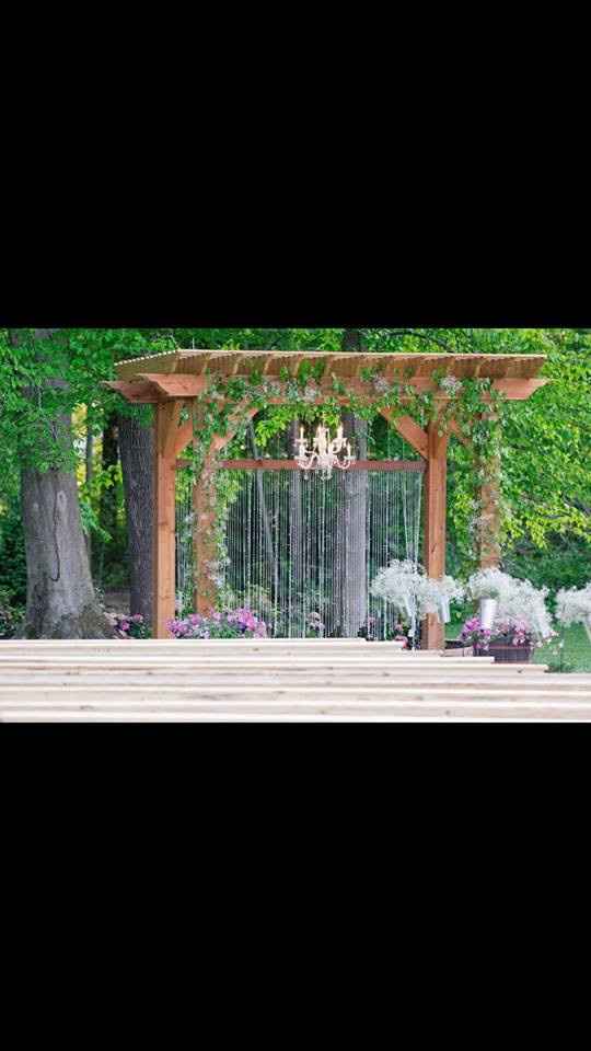 Here's the pergola at the location. We're keeping the chandelier and beaded curtain. There will be n