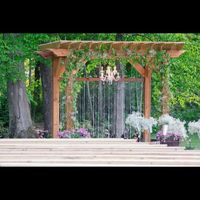 Here's the pergola at the location. We're keeping the chandelier and beaded curtain. There will be n