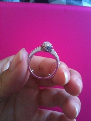 23 small diamonds, and one bigger diamond... I LOVE IT. Lets see some rings my fellow brides.