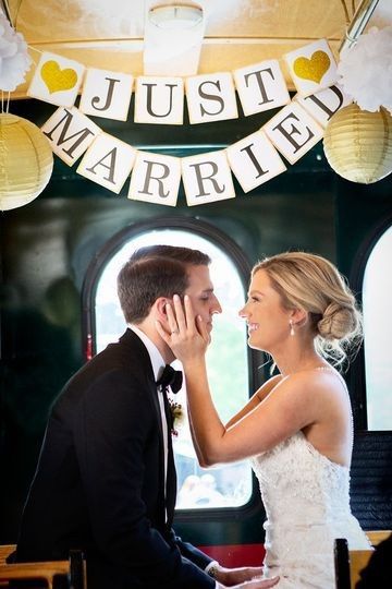 Married Couple with Just Married Sign on Trolley