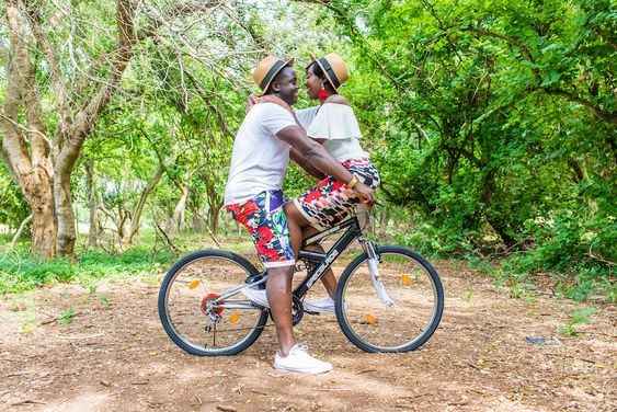 Fun Tropical Biking Engagement Photo
