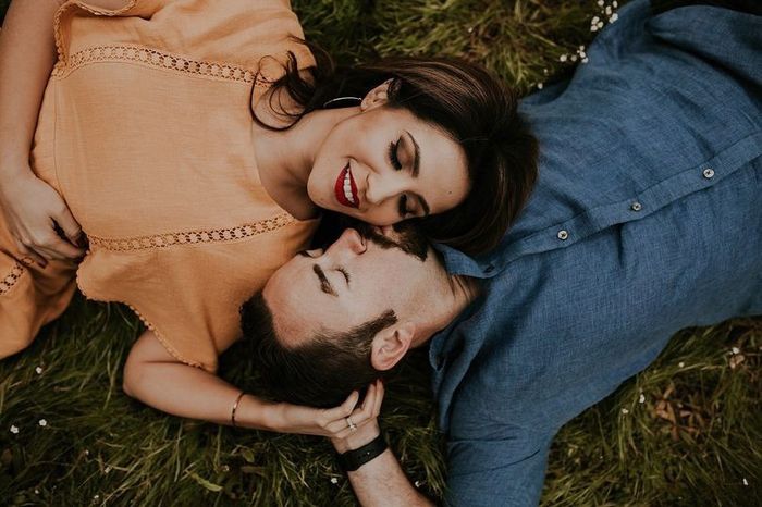 Engagement Pictures Kissing on the Cheek on Grass