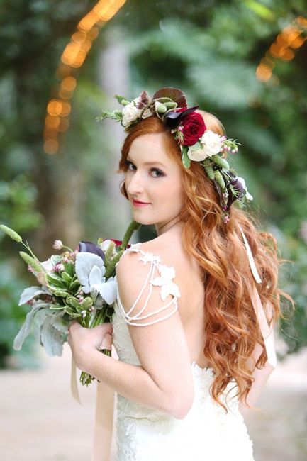 redheaded bride holding bouquet wearing a flower crown