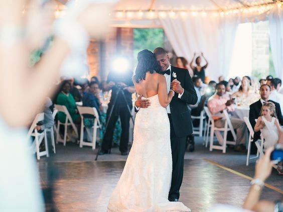 Videopgarher filming African american couple's first dance