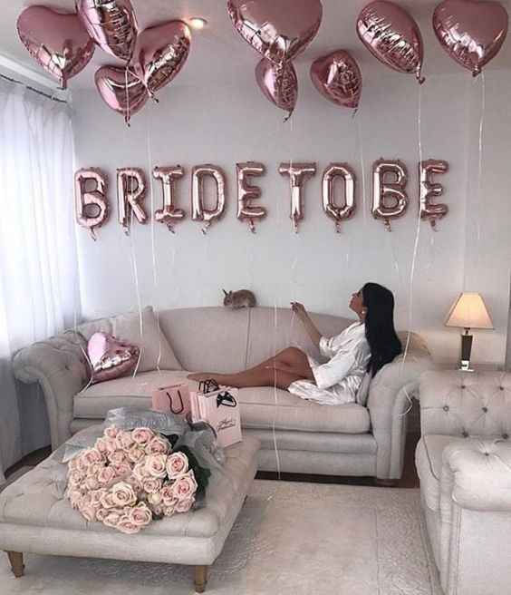 Bride To Be spelled out in pink balloons with neutral background