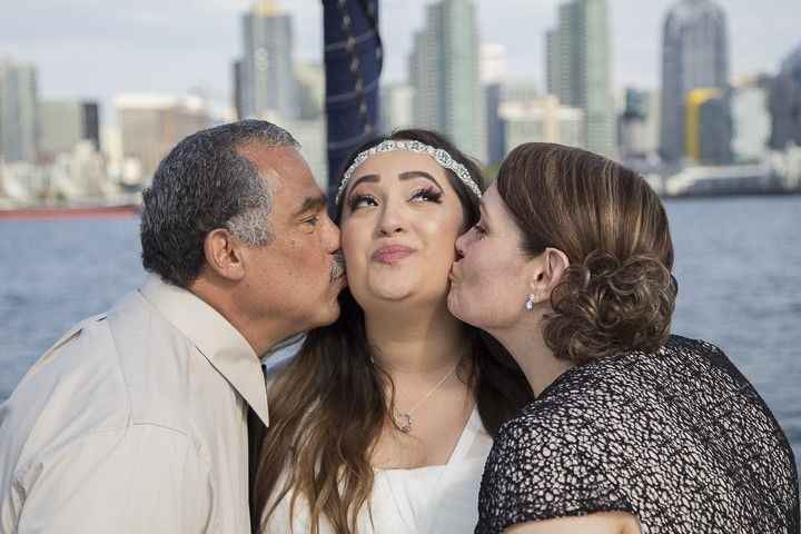 Couple kissing bride daughter
